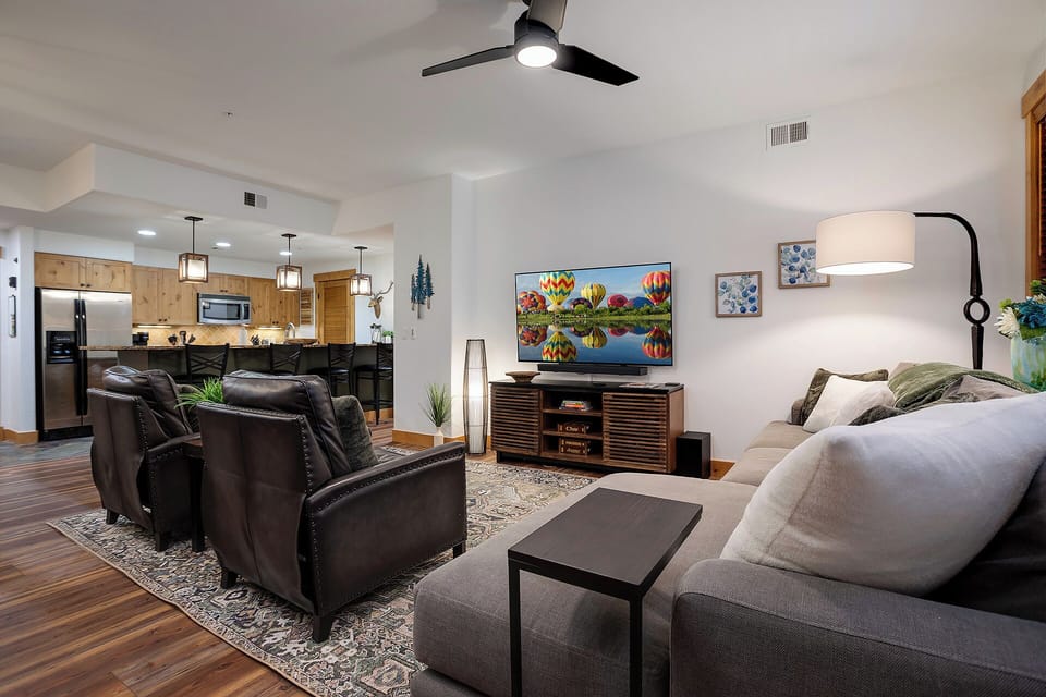 Unwind in your spacious living room where plush seating meets entertainment perfection, complete with modern kitchen just steps away.