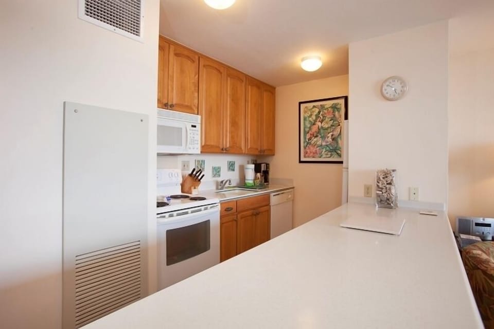 Your fully equipped kitchen awaits with everything you need—stove, microwave, dishwasher, and ample counter space for preparing meals and gathering with loved ones in comfort.