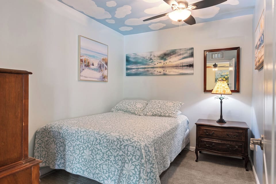 Blue bedroom on 3 bedroom side with queen bed,  49" HDTV - no closet or windows