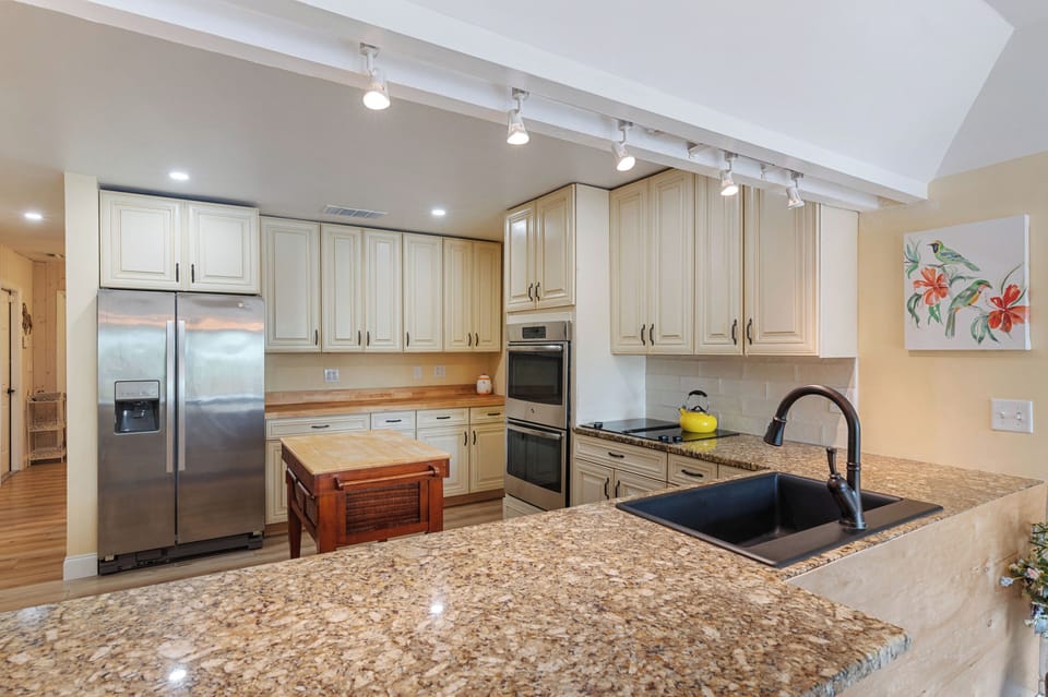 Full kitchen on 3 bedroom side with stainless appliances