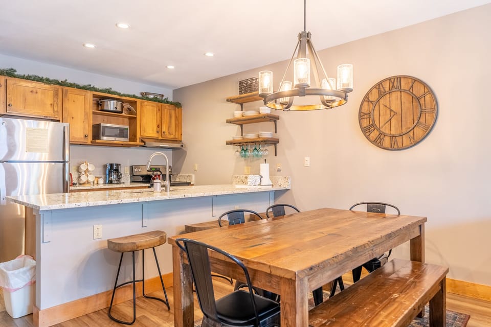 You'll love gathering around this rustic dining table with your group, enjoying meals from the fully equipped kitchen.