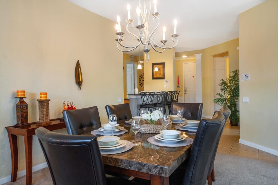 The dining area, spacious enough to accommodate six, sets the stage for elegant gatherings and cherished moments shared over delectable meals. A setting where laughter flows as freely as the conversation, creating memories to treasure.