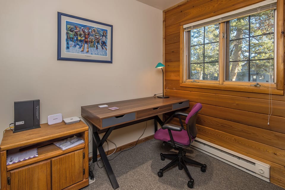 Set up a work day with beautiful views out the window in this office space | Lower Level