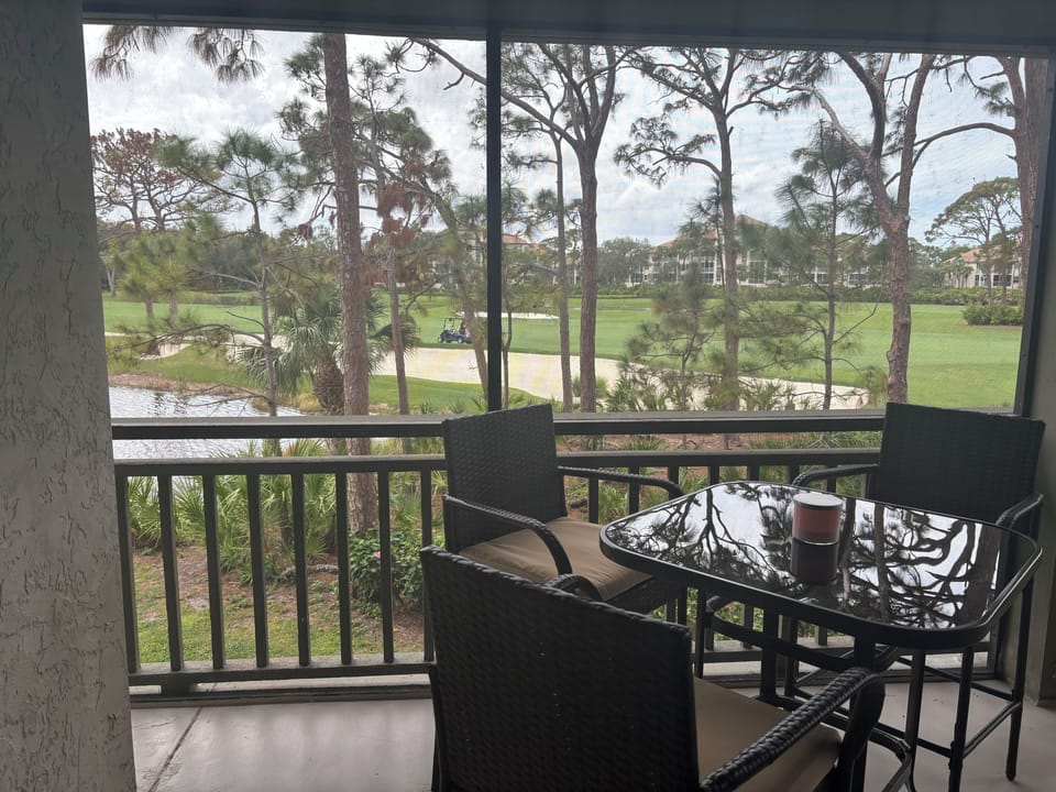 Screened in lanai with beautiful view of golf course and lake