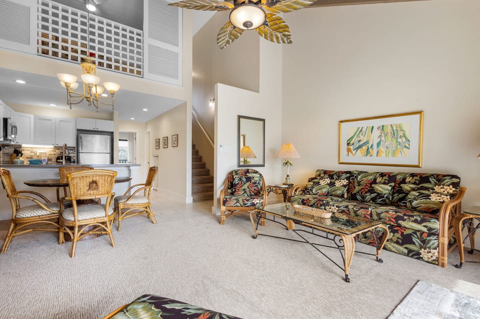 Relax in your spacious living area with vaulted ceilings, tropical décor, and a fully equipped kitchen just steps away—perfect for unwinding after a day of island adventures.