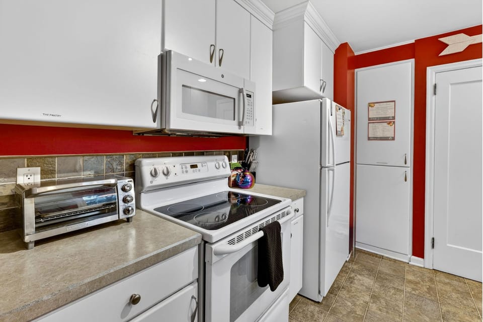 Cook and enjoy meals in the fully equipped kitchen with stove, oven, microwave, refrigerator, and utensils. Perfect for family meals, gatherings, and home-cooked comfort.