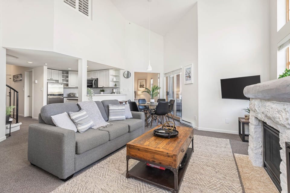 Modern mountain charm meets homey comfort in this inviting gathering space