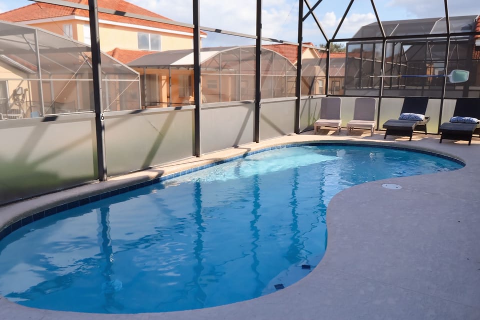 Screened in pool area showing private pool