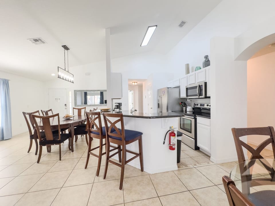 View of kitchen and dining room with seating for 6