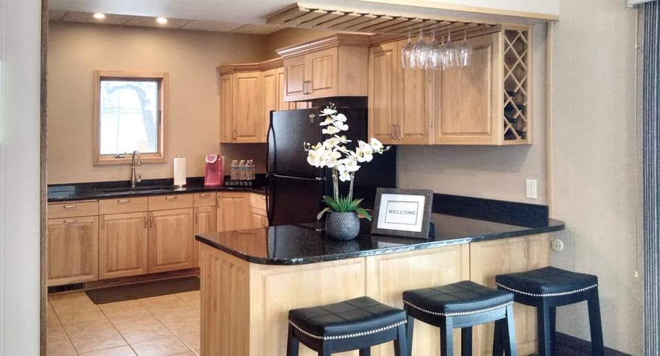 Fully equipped kitchen with granite counters and plenty of storage space.