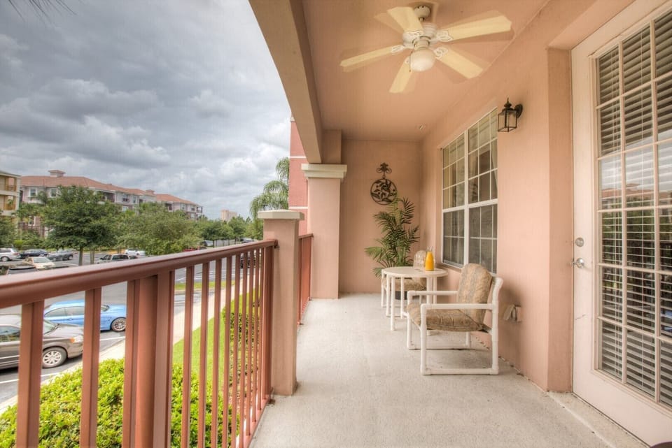 The balcony with chairs at Vista Cay Resort offers a serene escape, inviting guests to relax and soak in breathtaking vistas while enjoying the gentle embrace of the outdoors.