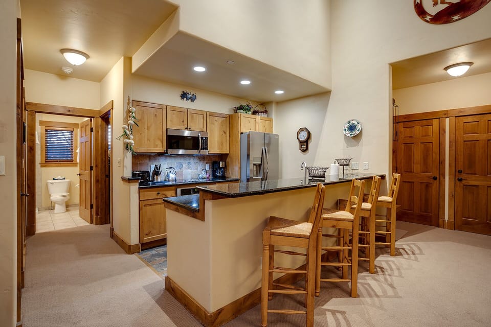Your fully-equipped kitchen with granite island creates the perfect space for cooking memorable meals together.