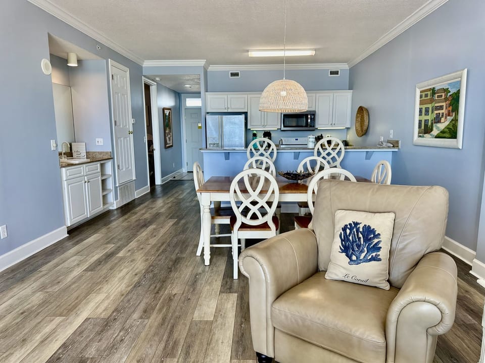 View from living room looking into dining and kitchen.