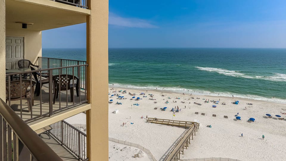 This balcony offers a perfect spot to unwind while enjoying the serene beach view and gentle waves
