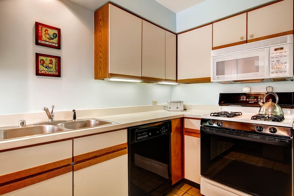 The kitchen w/ upgraded appliances