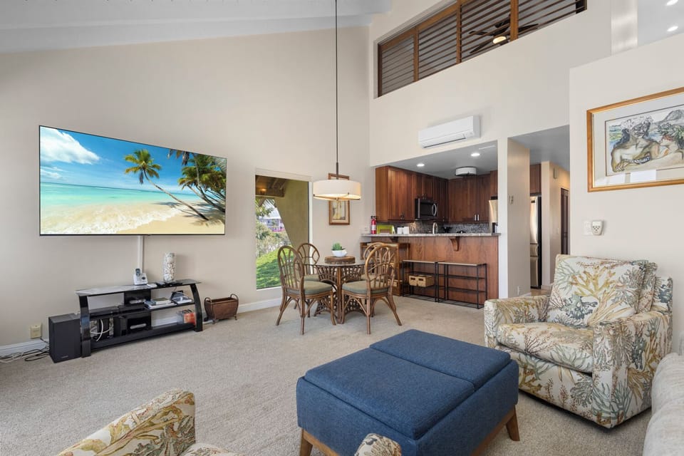 Relax in your bright, open living space with vaulted ceilings, cozy seating, a large TV for movie nights, and a dining area that opens to your fully equipped kitchen.
