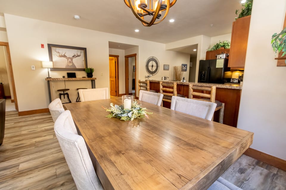 Gather around your spacious dining table where memorable meals and conversations unfold in this beautifully appointed open-concept space.