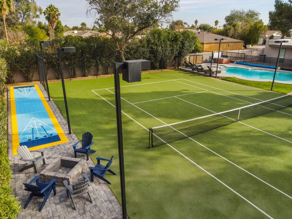 Regulation size Tennis court with a sports court turf overlay. 