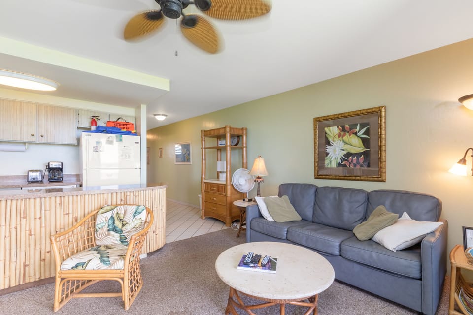 Relax in your tropical-inspired living space, where breezy décor meets thoughtful comfort and a fully equipped kitchen invites easy meal prep.