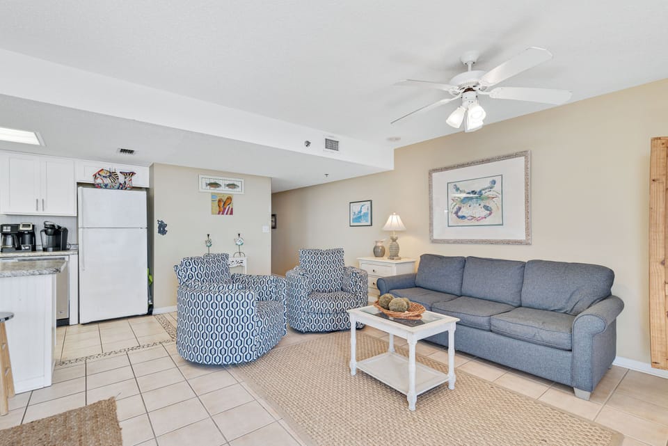 Spacious Living Room offers Comfortable Seating, Beachfront Views and Balcony Access