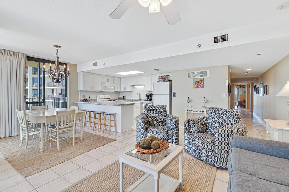 Spacious Living Room offers Comfortable Seating, Beachfront Views and Balcony Access