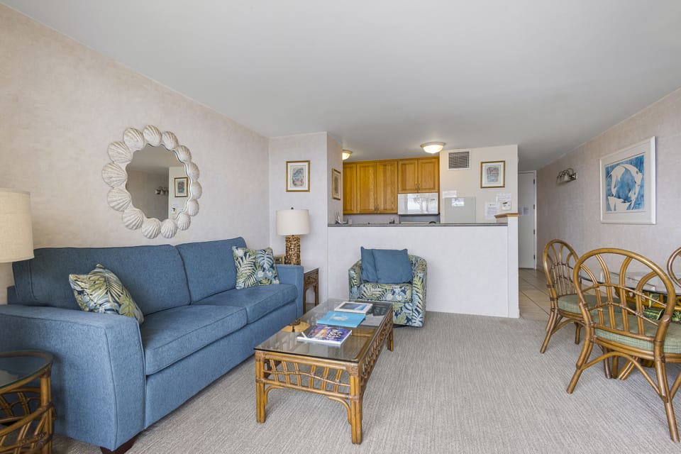 Relax in your welcoming living space with coastal-inspired decor, a comfortable sofa, and an open layout connecting to your fully equipped kitchen—perfect for unwinding after your island adventures.