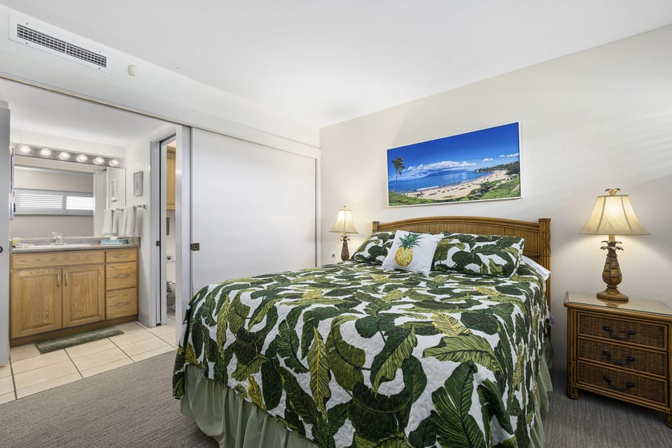 Unwind in your tropical retreat with island-style decor, cozy bedding, and climate-controlled comfort. The en-suite bath offers extra convenience for your stay.