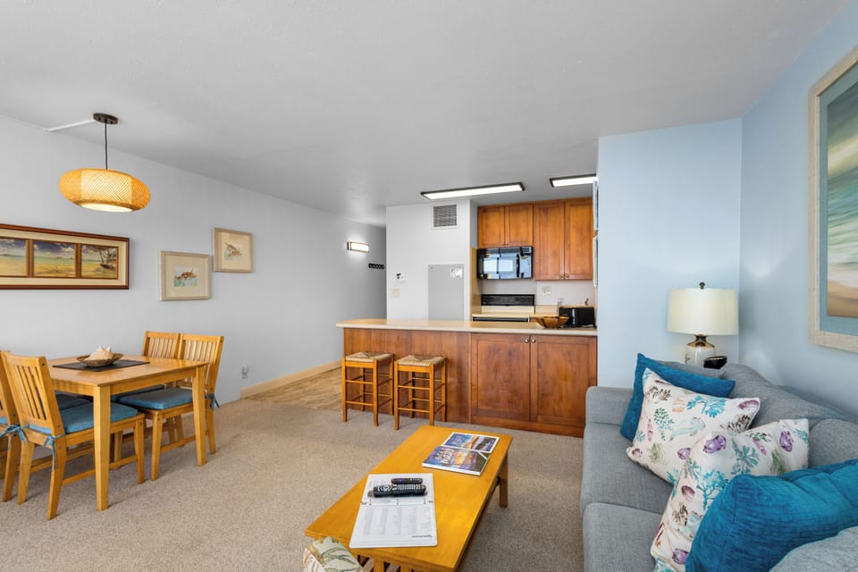 Your bright, open living space with a fully equipped kitchen, dining area, and cozy seating area—perfect for unwinding after a day of exploring the coast.