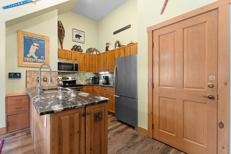 Your fully equipped kitchen awaits with gorgeous granite countertops, modern appliances, and plenty of space to whip up your favorite meals during your mountain getaway.