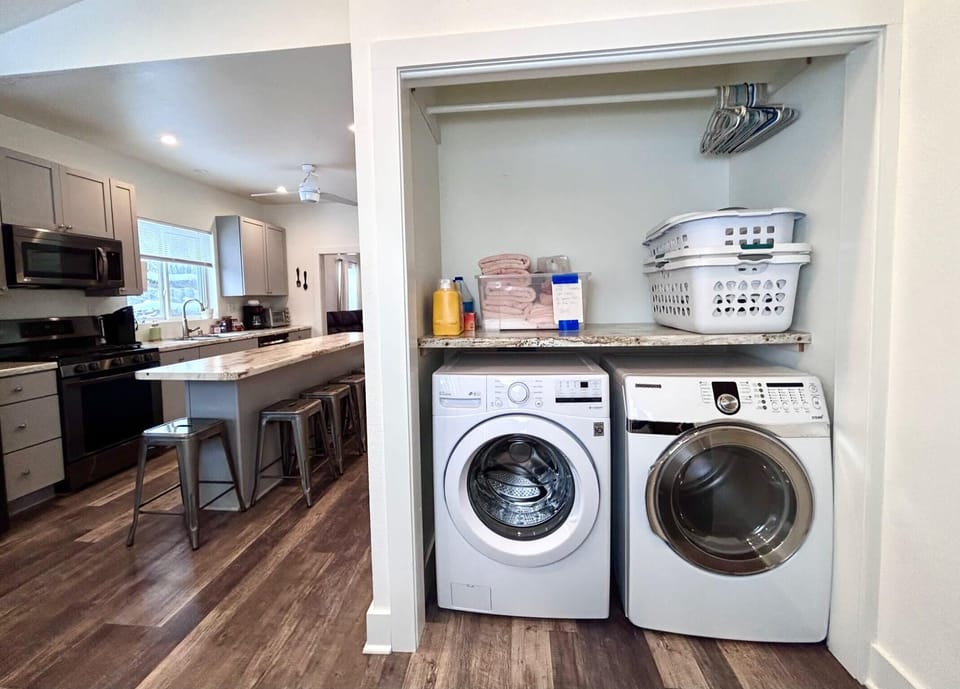 Large capacity washer and dryer with provided supplies.