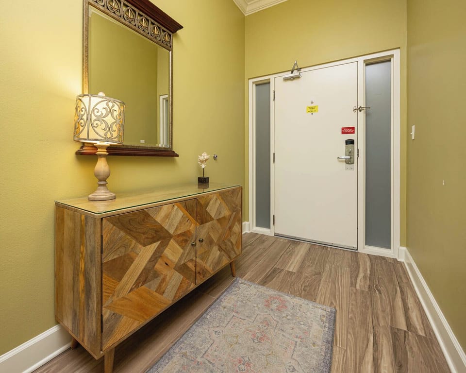 Step into this welcoming entryway, where soft lighting and unique decor set the tone for your beach getaway