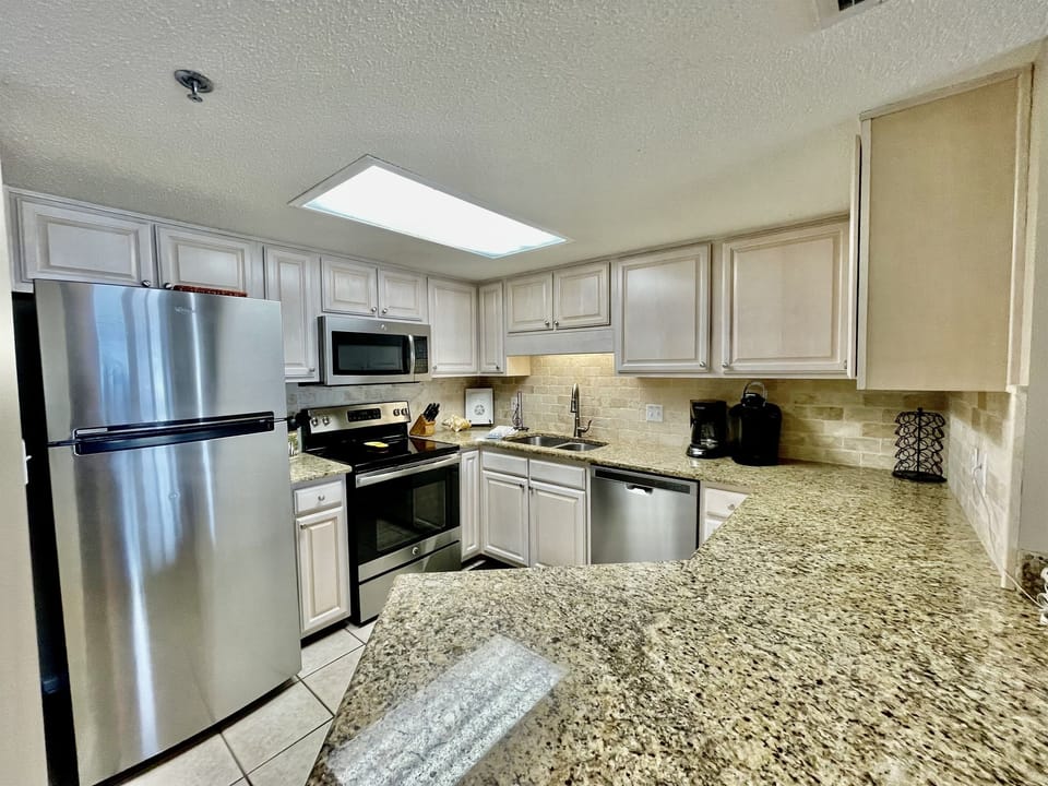 This fully stocked kitchen has upgraded stainless steel appliances and is ideal for any vacation meal!!