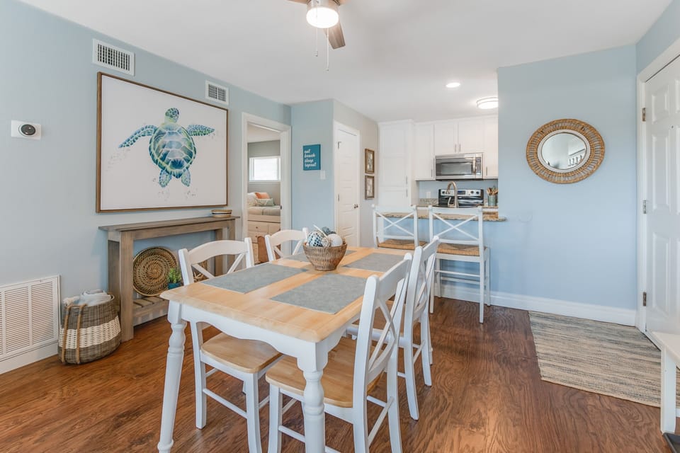 Gather around your coastal dining table where sea turtle artwork sets a serene tone for memorable meals together.