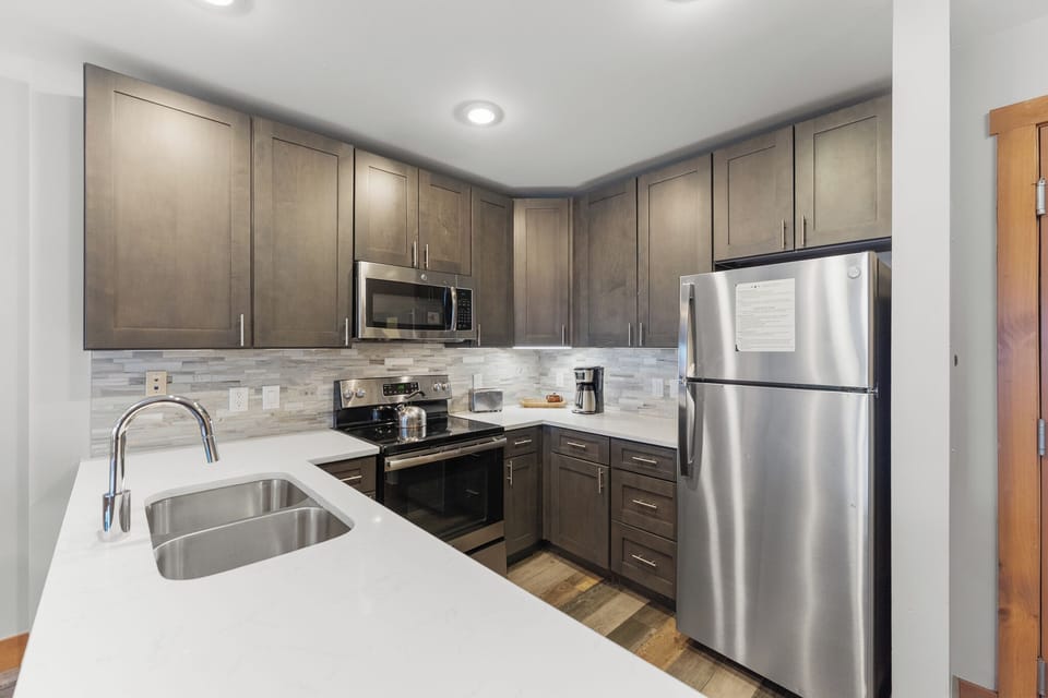 Your fully equipped kitchen awaits with granite counters, stainless appliances, and everything needed to create memorable meals during your stay.