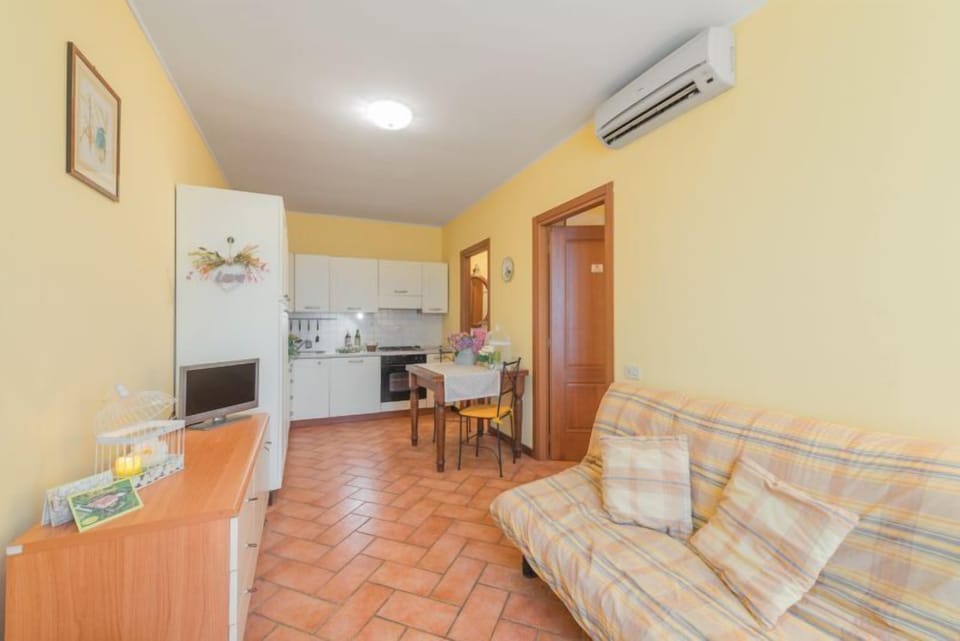 Apartment, 1 Bedroom | Living room | Flat-screen TV