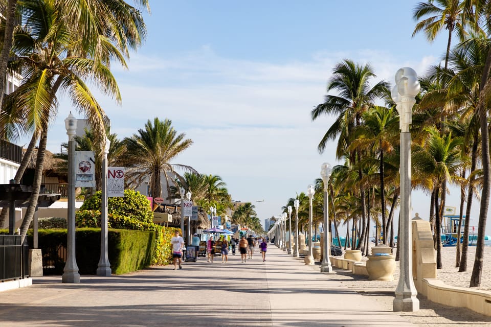 On the beach, white sand, beach cabanas, sun loungers