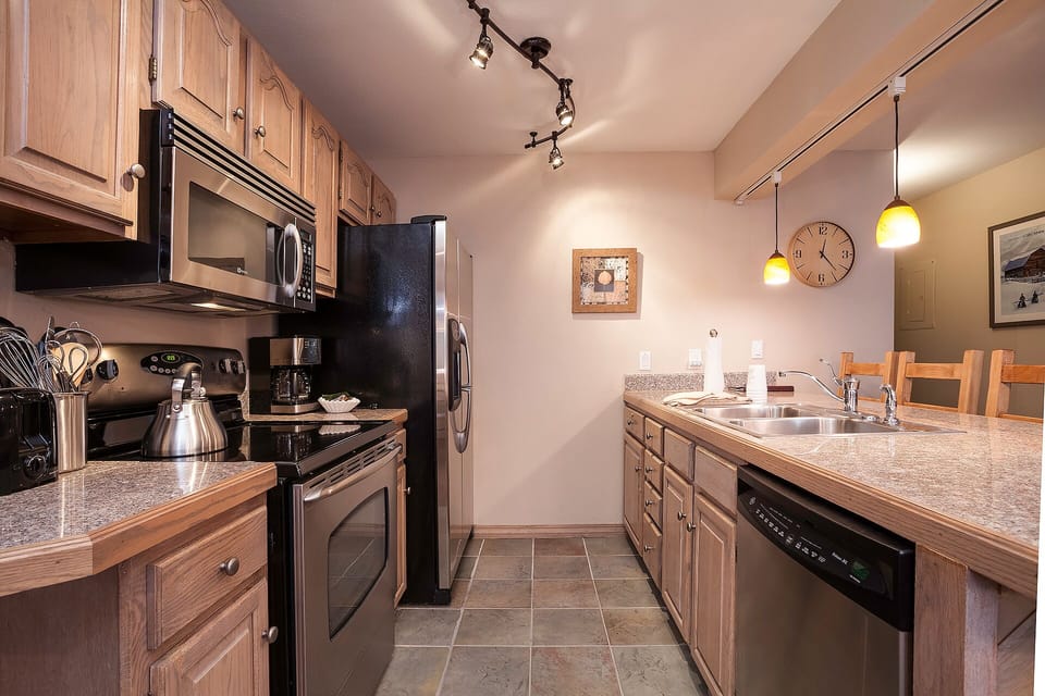 Your fully equipped kitchen features granite counters, stainless appliances, and everything you need to create memorable meals during your stay.