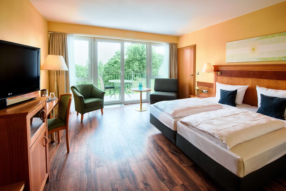 Superior Twin Room | Minibar, in-room safe, desk, laptop workspace