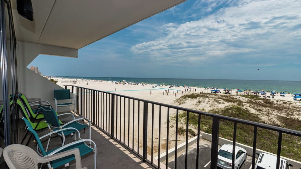 Enjoy breathtaking beach views from the balcony, complete with comfortable seating for relaxation and sunbathing