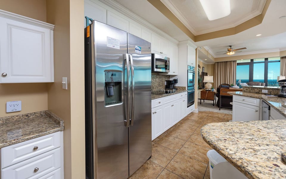 Upgrade your culinary experience in this stylish kitchen with modern stainless appliances and elegant design