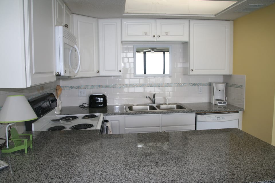Lots of storage and surface area in the open concept kitchen.  