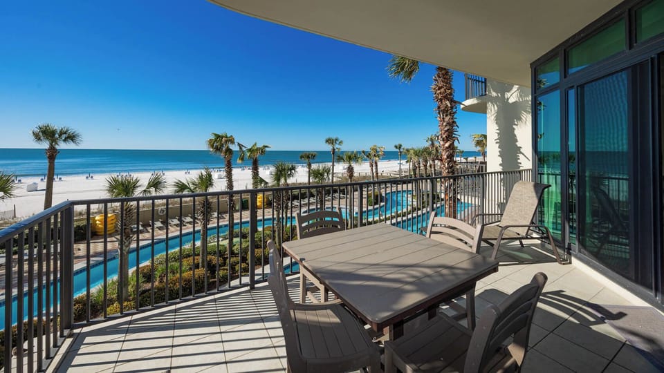 Relax on your balcony and bask in the sunlight with mesmerizing views of the gulf coast on your beach retreat