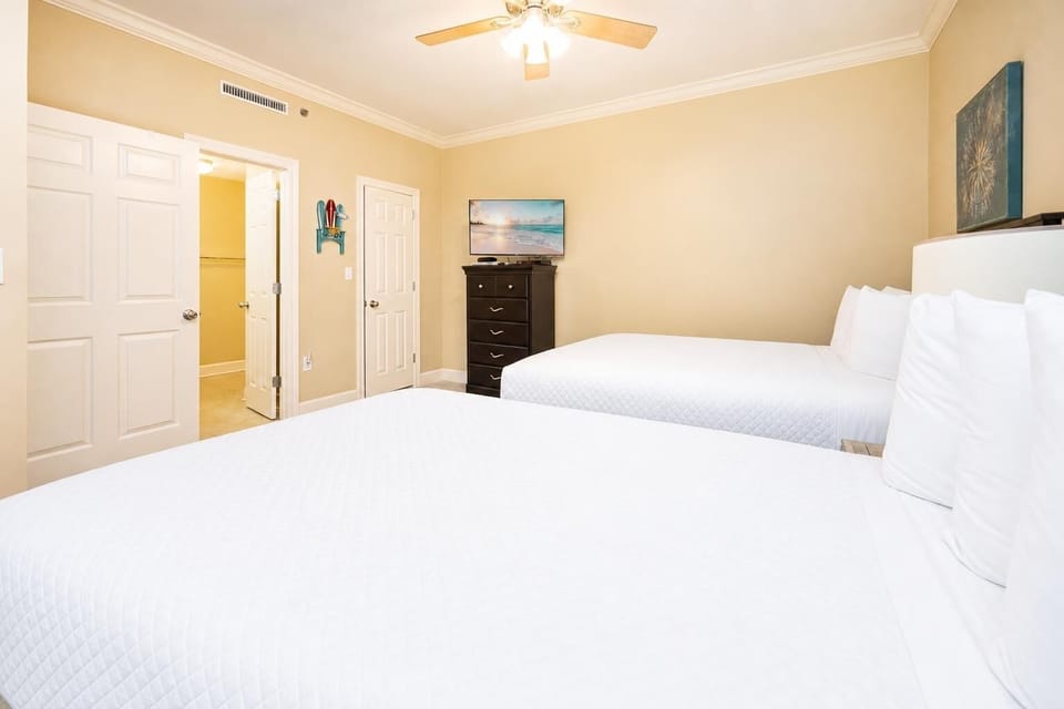 The guest suite offers restful nights on two queen beds with a TV ready for your favorite shows