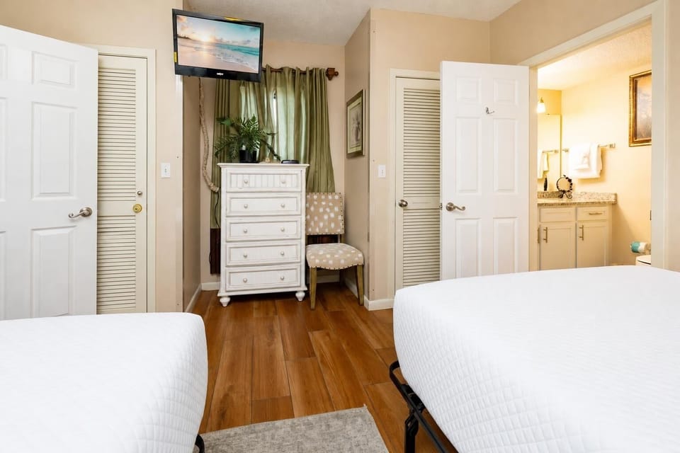 Two doubles in the guest suite offer restful sleep after a day filled with coastal adventures and fun
