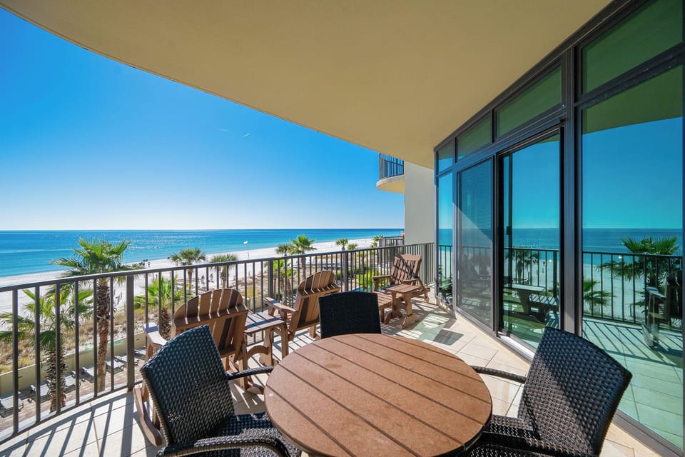 Relax in your lounge chairs as you soak in the sun and admire the stunning beach views from your balcony