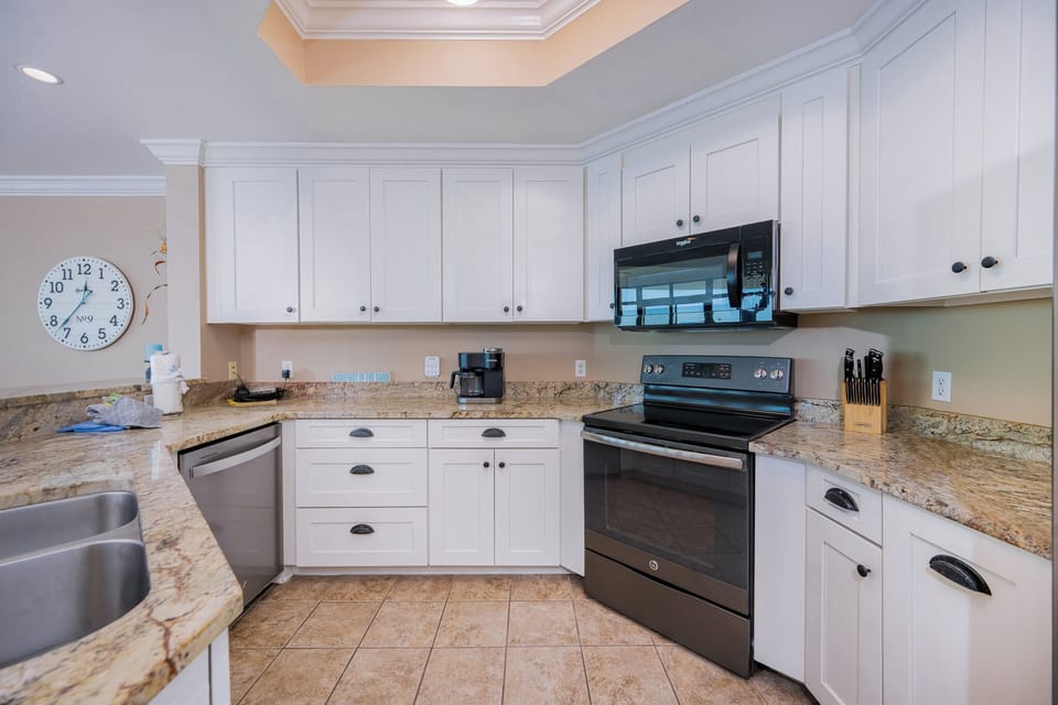 Cook your family's favorite meals in this inviting kitchen, featuring ample counter space and sleek appliances