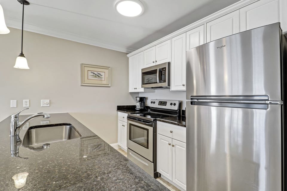 Kitchen - “Bright, fully equipped kitchen with modern appliances and ample counter space—perfect for cooking and entertaining.”