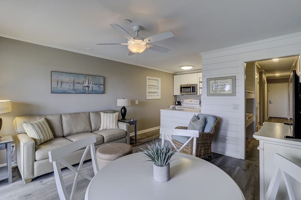 Living room and dining room - This beautifully decorated Oceanfront villa has been totally renovated.

The Living Room has designer furnishings and new wood grain tile flooring.