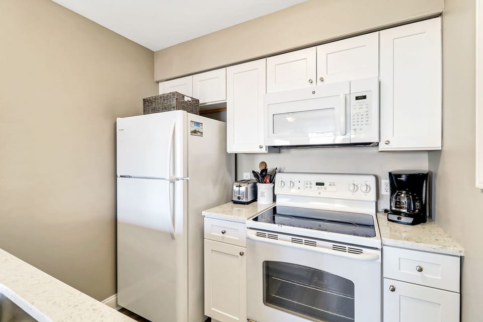 Ocean Dunes Villa 312 - Kitchen - The kitchen is equipped with all the major appliances you need to prepare your favorite meal.