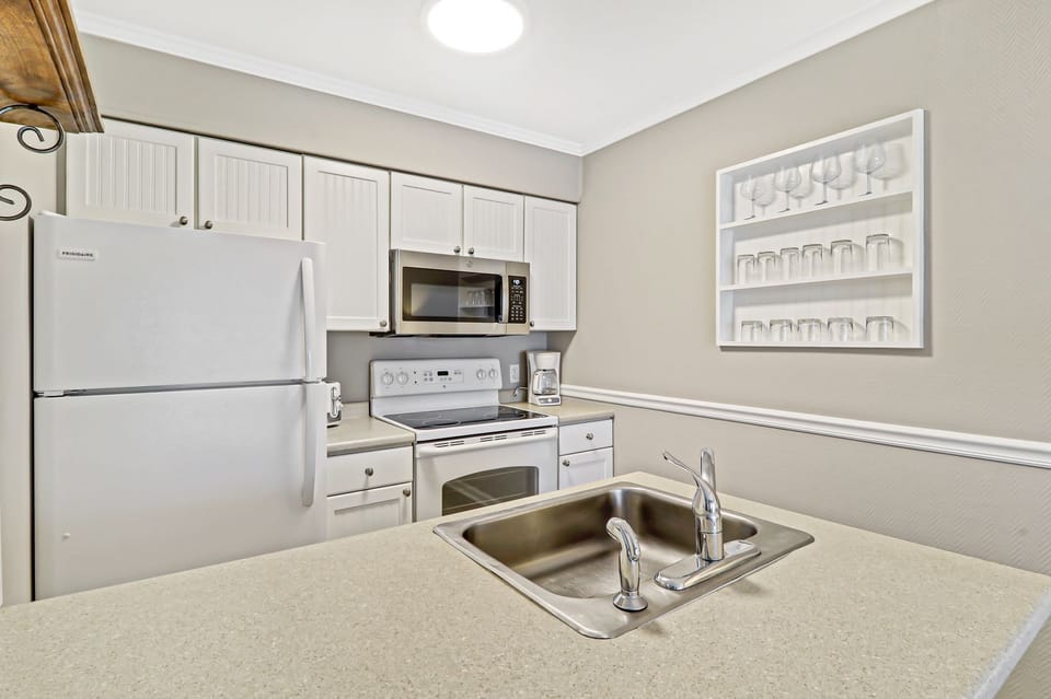 Kitchen - Newly painted full sized kitchen with new microwave and regular drip coffee maker.  Plenty of glassware for all your beverages.
